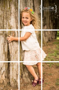 Girl posing by a tree