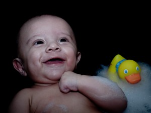Here I set up a black sheet in my son's baby bathtub to capture a moment with his rubber ducky.